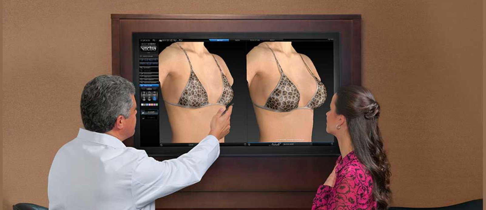 Specialist with patient checking breast analysis
